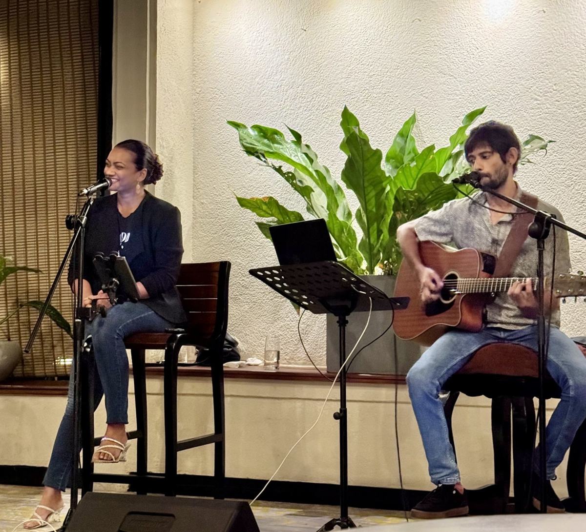Singer and acoustic guitarist performing together